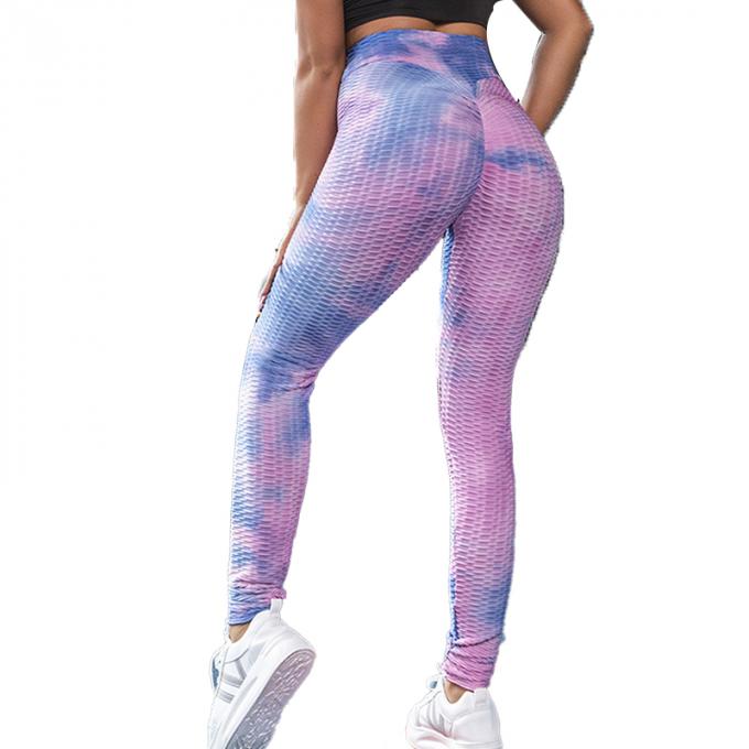 La vente en gros teignent en nouant le contrôle de ventre de pantalon de yoga les guêtres qu'extensibles de séance d'entraînement ont donné au yoga une consistance rugueuse Legging pour des femmes