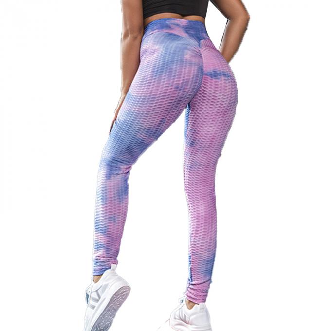 La vente en gros teignent en nouant le contrôle de ventre de pantalon de yoga les guêtres qu'extensibles de séance d'entraînement ont donné au yoga une consistance rugueuse Legging pour des femmes