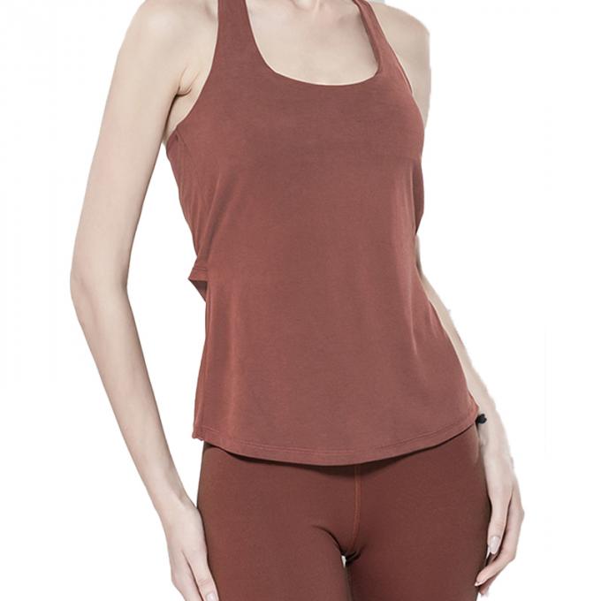 Les sports en gros investissent l'habillement de la forme physique des femmes courant la beauté supérieure de retour folâtre le dessus lâche supérieur de yoga avec le soutien-gorge
