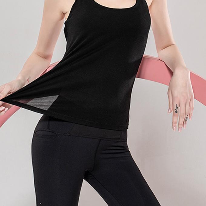 Les sports en gros investissent l'habillement de la forme physique des femmes courant la beauté supérieure de retour folâtre le dessus lâche supérieur de yoga avec le soutien-gorge