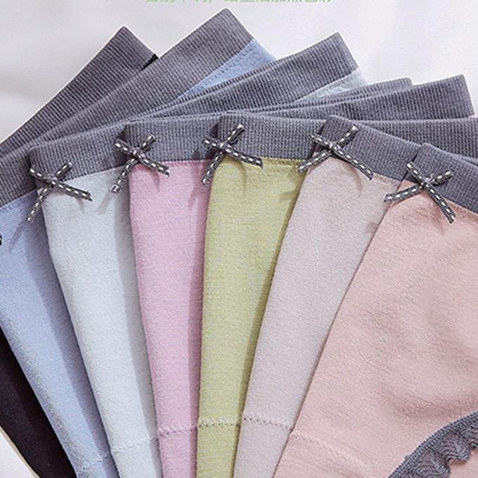 Les culottes en gros de sous-vêtements lacent la culotte de bikini pour femmes sans couture de sous-vêtements de coton de taille de femmes de mi