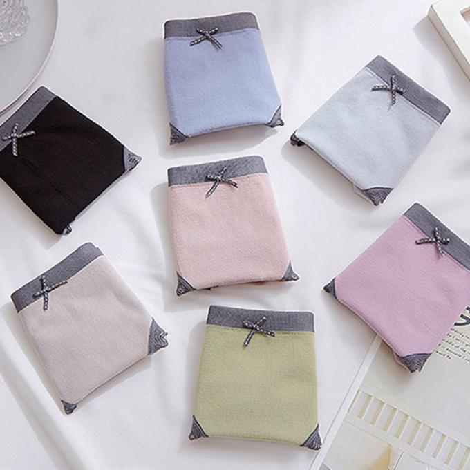Les culottes en gros de sous-vêtements lacent la culotte de bikini pour femmes sans couture de sous-vêtements de coton de taille de femmes de mi