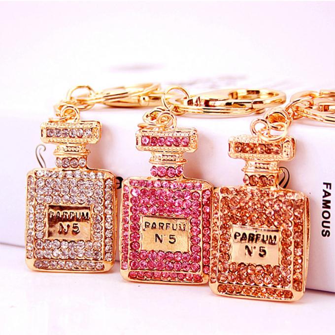 Les dames Diamant-cloutées créatives parfument le métal femelle Crystal Keychain de fausse pierre d'accessoires de sac de chaîne principale de bouteille