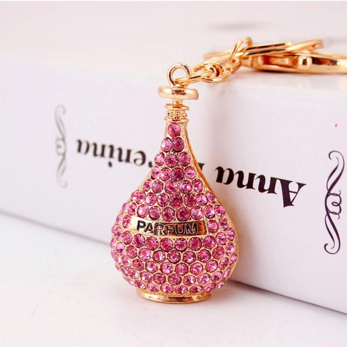 Les dames Diamant-cloutées créatives parfument le métal femelle Crystal Keychain de fausse pierre d'accessoires de sac de chaîne principale de bouteille