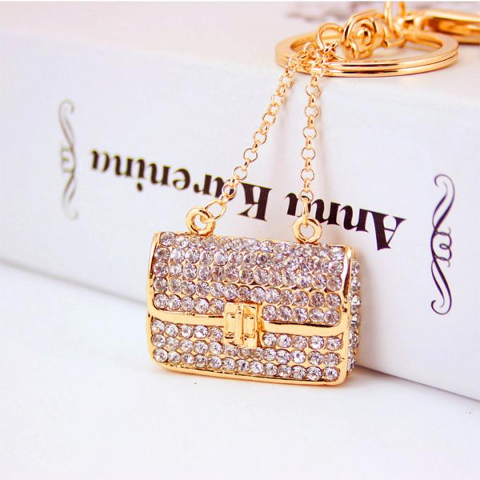 Les dames Diamant-cloutées créatives parfument le métal femelle Crystal Keychain de fausse pierre d'accessoires de sac de chaîne principale de bouteille