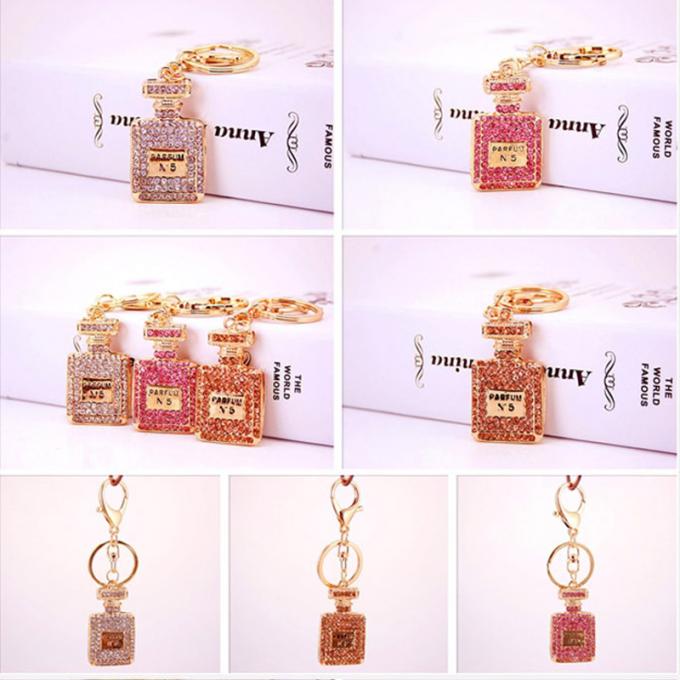 Les dames Diamant-cloutées créatives parfument le métal femelle Crystal Keychain de fausse pierre d'accessoires de sac de chaîne principale de bouteille