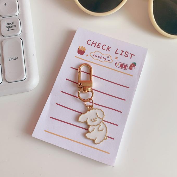 Le sac pendant de lapin de chaîne principale petit en métal en gros de fleur ornemente la bande dessinée mignonne Keychains d'accessoires pour des femmes