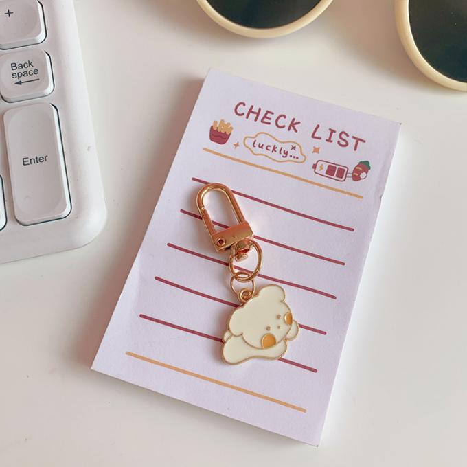 Le sac pendant de lapin de chaîne principale petit en métal en gros de fleur ornemente la bande dessinée mignonne Keychains d'accessoires pour des femmes