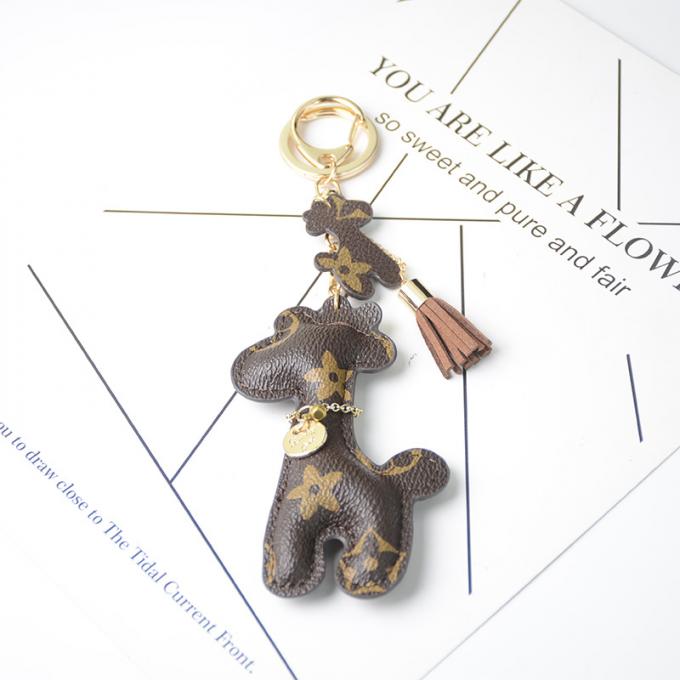 Le sac pendant en cuir en gros de chaîne principale de chien d'ours ornemente des accessoires Diamond Bear Keychain Keychains pour des femmes